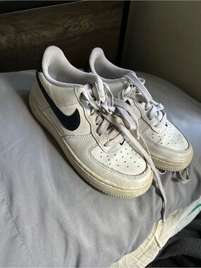 Nike Kids White Sneakers with Black Swoosh and Cream Sole